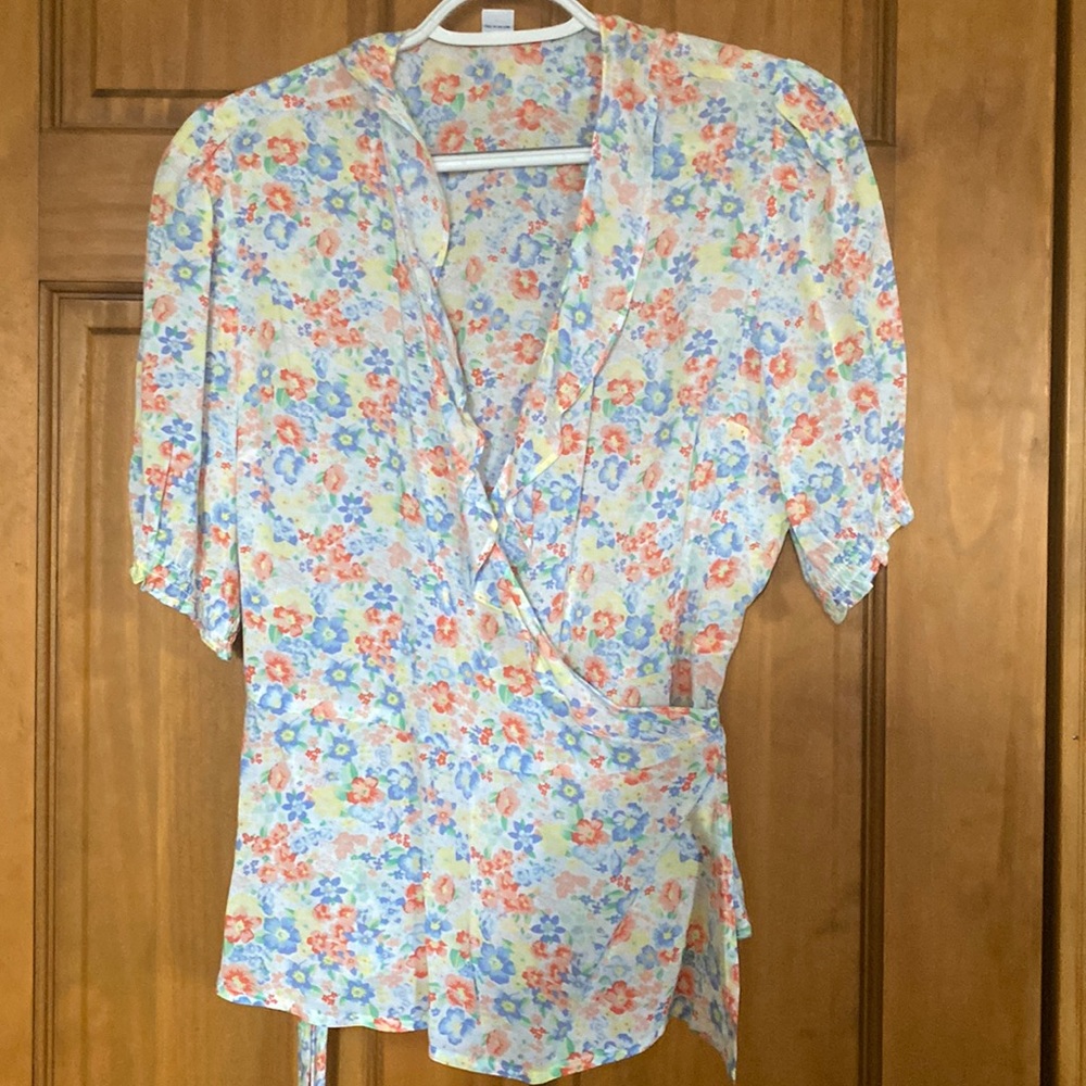 Pretty feminine wrap around blouse.